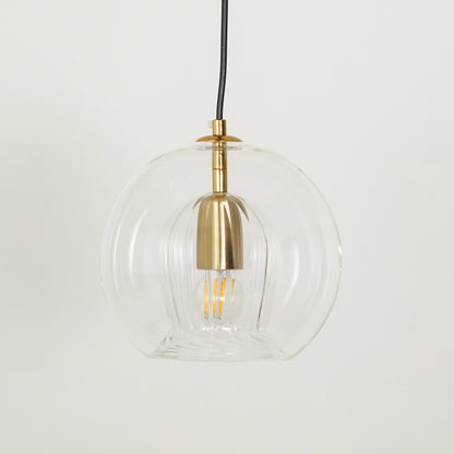 White background image of glass round ball hanging pendant lamp for elegant dining room decor styling and modern lighting.