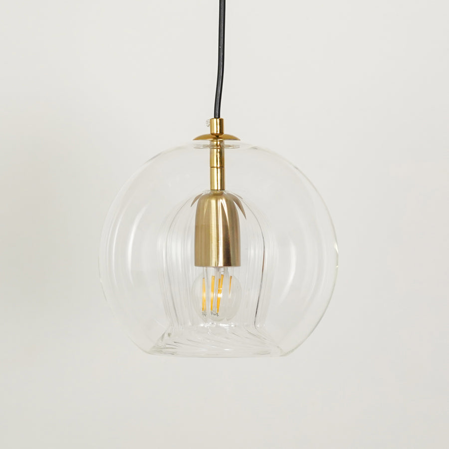 White background image of glass round ball hanging pendant lamp for elegant dining room decor styling and modern lighting.