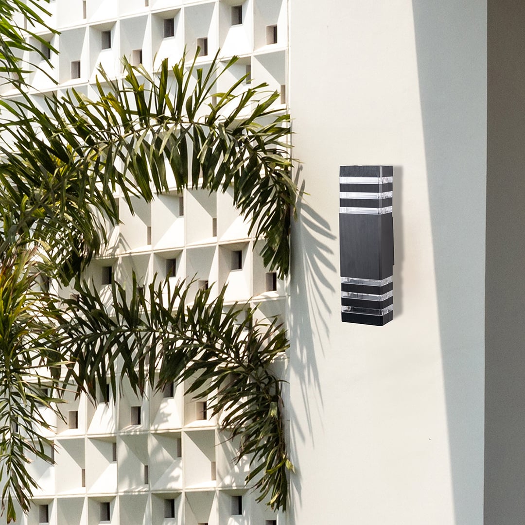 Contemporary black wall light illuminating walls with soft ambient lighting for a refined modern look.