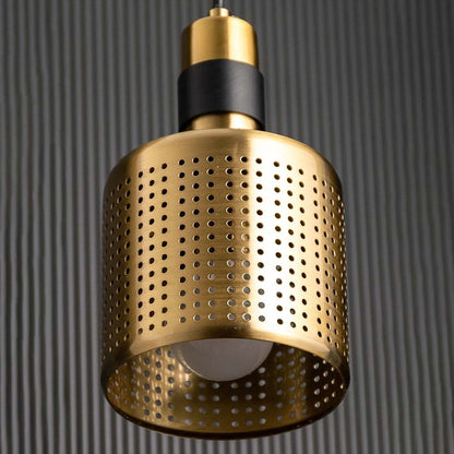 A closeup view of the gold perforated pendant light showing the dotted metal texture and warm interior tone ideal for stylish contemporary interiors.
