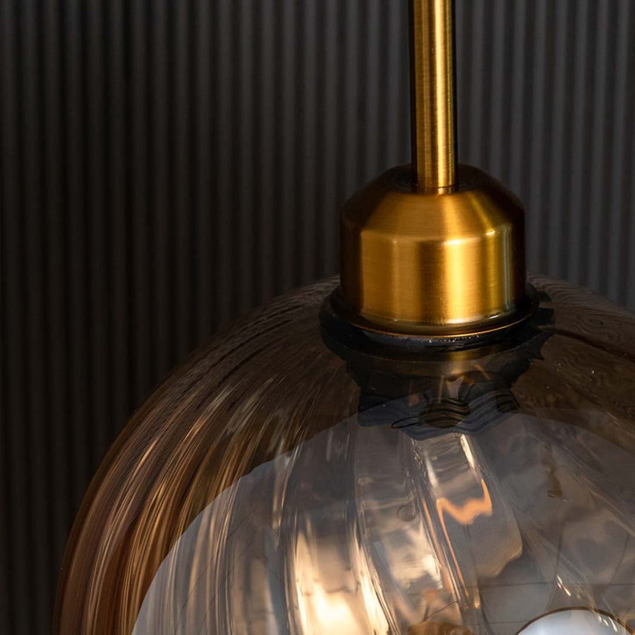 showing textured glass details and soft reflections for a modern luxury lighting look.
