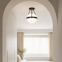 Black metal outdoor ceiling light for porch entrance balcony and covered patio with warm ambient illumination.