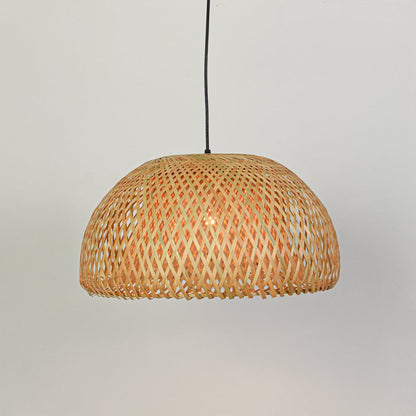 Handwoven natural rattan pendant light designed for stylish dining room and living room decor.