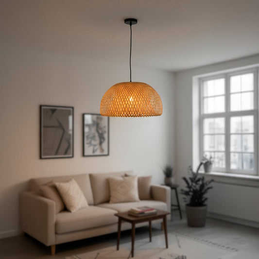 Natural rattan pendant light with woven dome shade hanging from ceiling adding warm boho style to dining and living interiors.