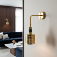 Luxury gold metal wall light with warm glow for modern living room and premium home decor spaces.