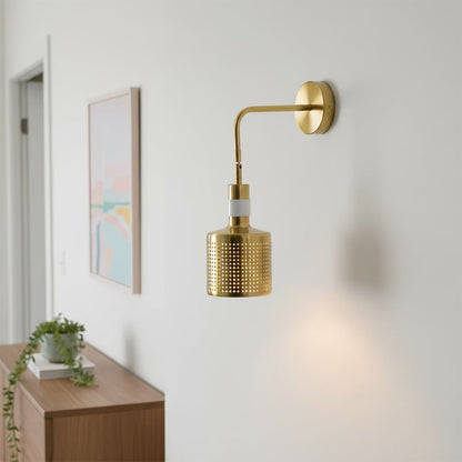 Modern gold metal wall light with perforated shade for elegant hallway and luxury decor styling spaces.