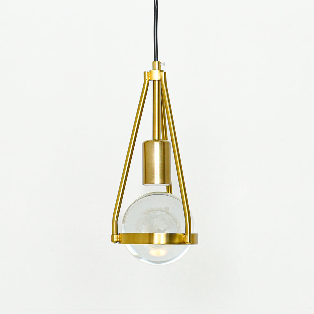 Textured clear glass and gold metal pendant light designed for stylish contemporary interior spaces.