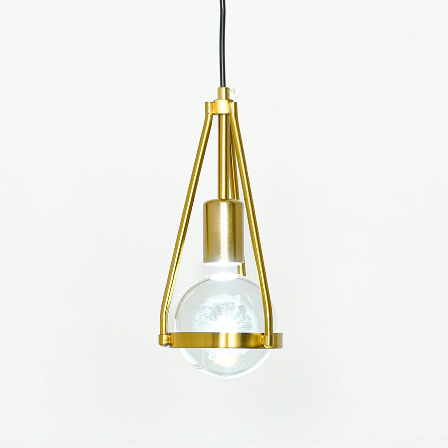 Textured clear glass and gold metal pendant light with geometric frame for modern home decor spaces.