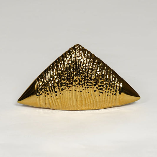 Gold striped ceramic triangle table accent isolated on clean white background for statement decor styling.