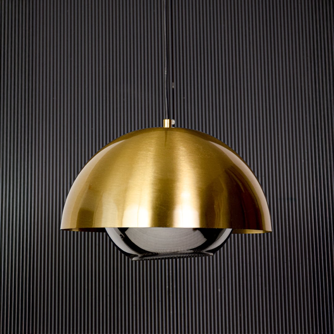 Golden dome pendant light with glass diffuser modern ceiling lamp for dining and living room stylish interiors black background.