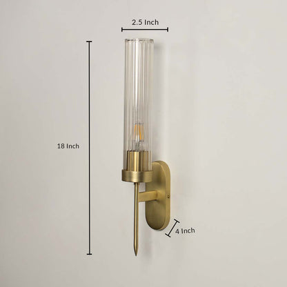 Contemporary brass metal wall light measuring 58 cm height with clear glass shade for luxury interiors.
