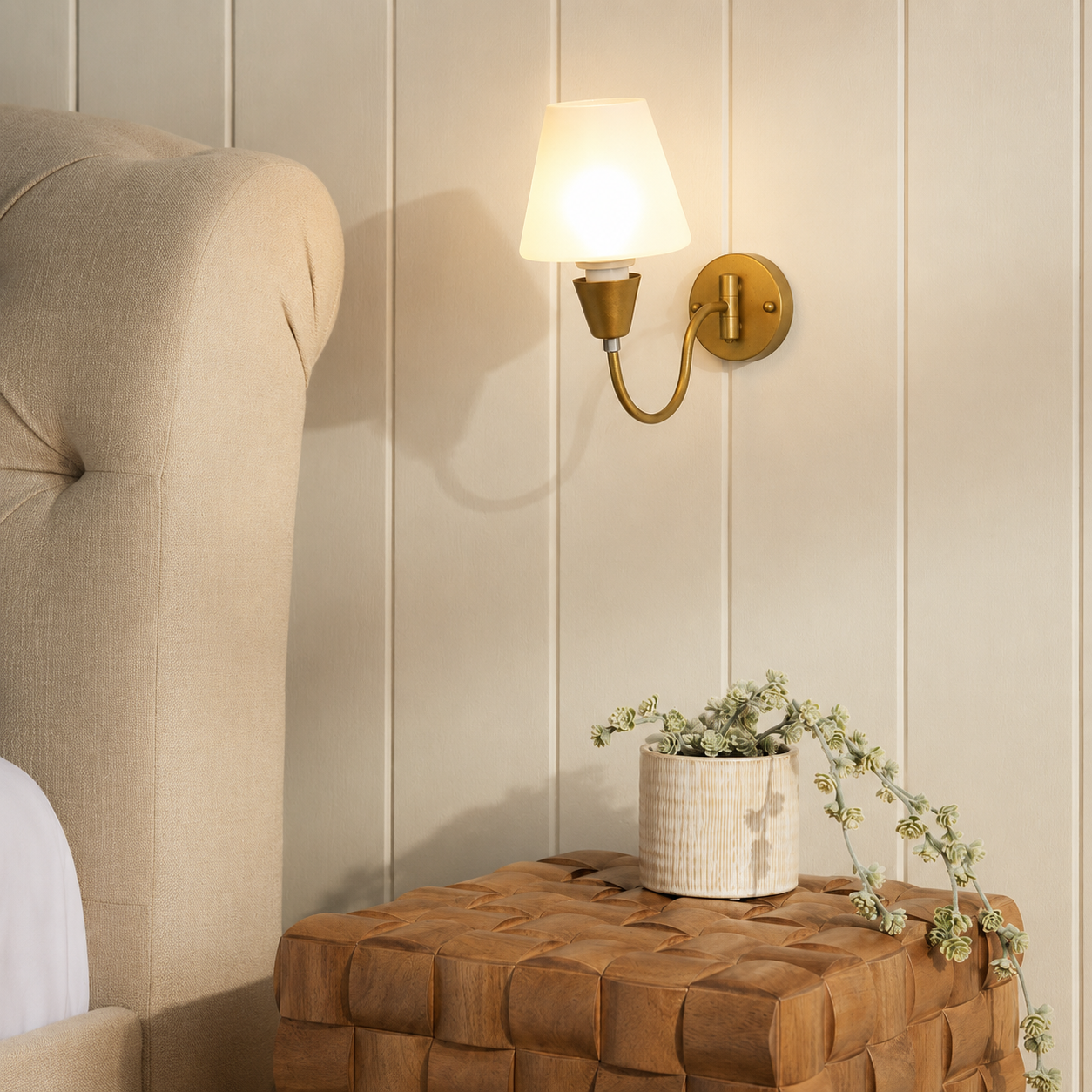 Lifestyle image of gooseneck brass swivel wall sconce for elegant modern living room decor styling and luxury lighting.