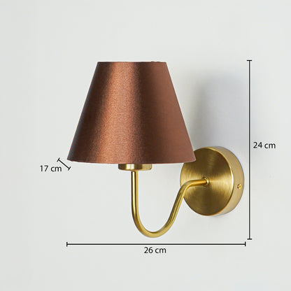 Modern wall light in gold metal finish with brown fabric shade showing 24 cm height 26 cm width and 17 cm shade size white background.