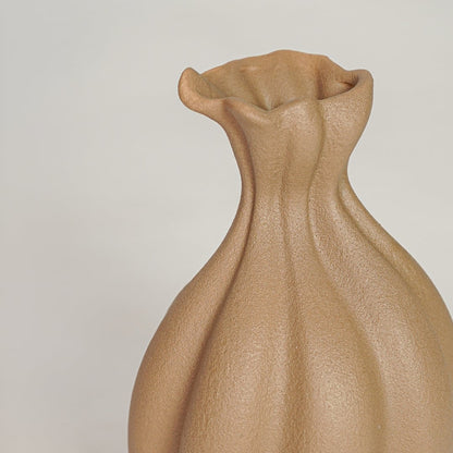 Beige ceramic decorative vase with textured sculpted petal form perfect for elegant dried floral display and interior decor.