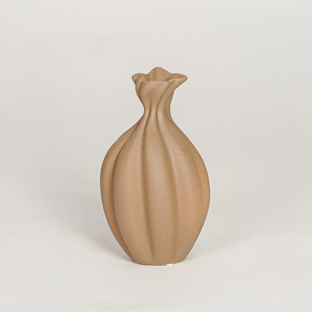 Modern beige ceramic decorative vase with organic sculpted design ideal for console table shelf and stylish home decor.