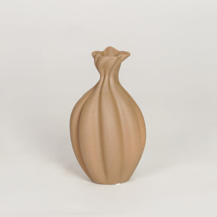 Modern beige ceramic decorative vase with organic sculpted design ideal for console table shelf and stylish home decor.