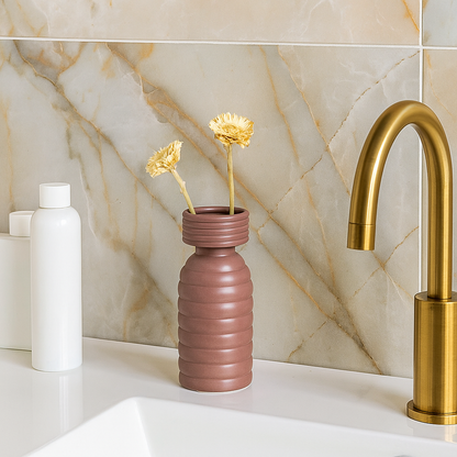 Brown ribbed ceramic vase adding warm modern decor to shelves or tables in contemporary living spaces.