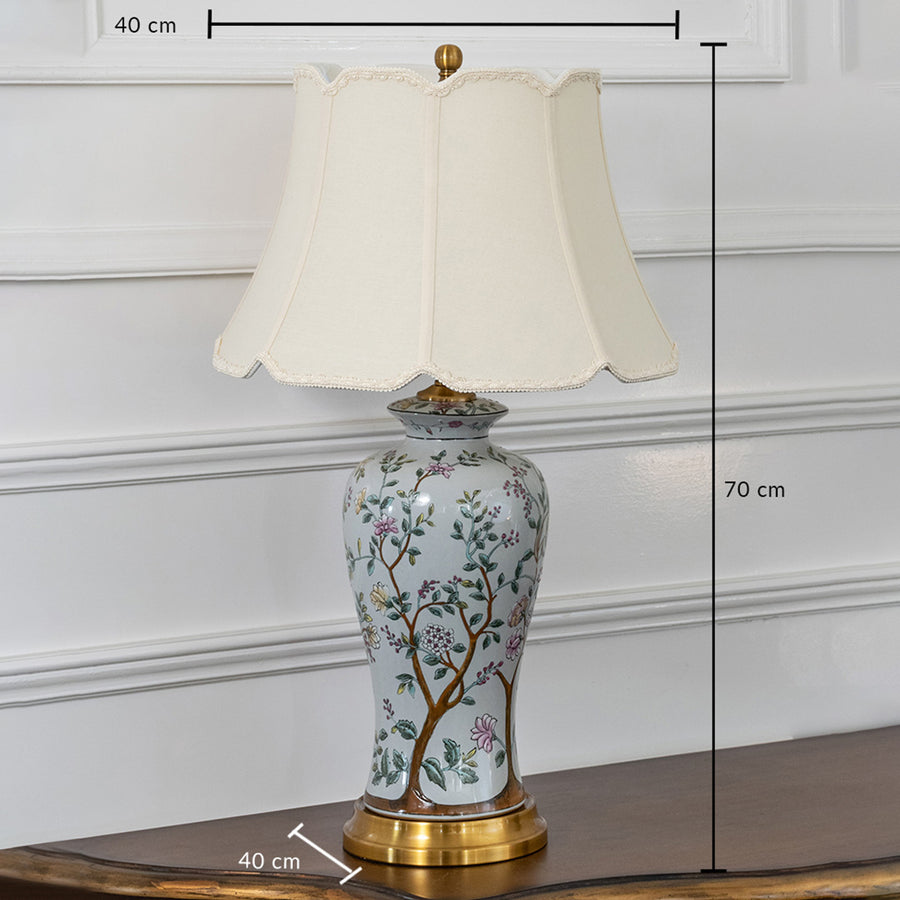 White floral ceramic table lamp with fabric shade measuring 70 cm height creating elegant traditional table lighting.