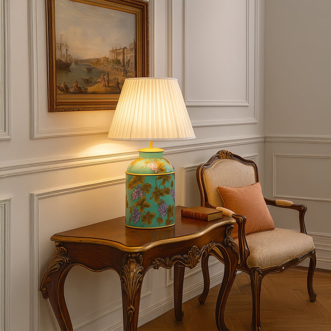 Palais mint green ceramic table lamp with pleated cream shade styled on wooden console creating elegant and artistic home lighting.