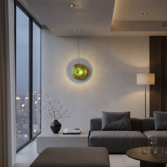 Modern green glass wall light with warm glow for luxury living room and contemporary home decor spaces.

