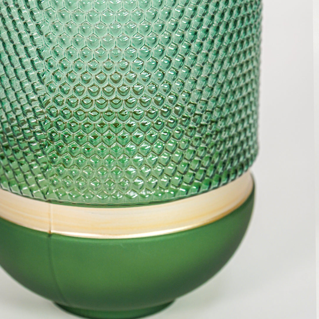 Closeup of green textured glass decorative vase showcasing intricate pattern and premium decorative craftsmanship details.
