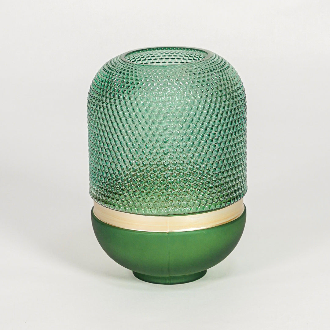 Green textured glass decorative vase with rounded silhouette for elegant tabletop styling and modern home decor.