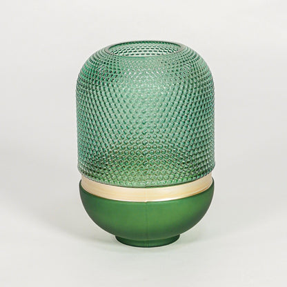 Green textured glass decorative vase with rounded silhouette for elegant tabletop styling and modern home decor.