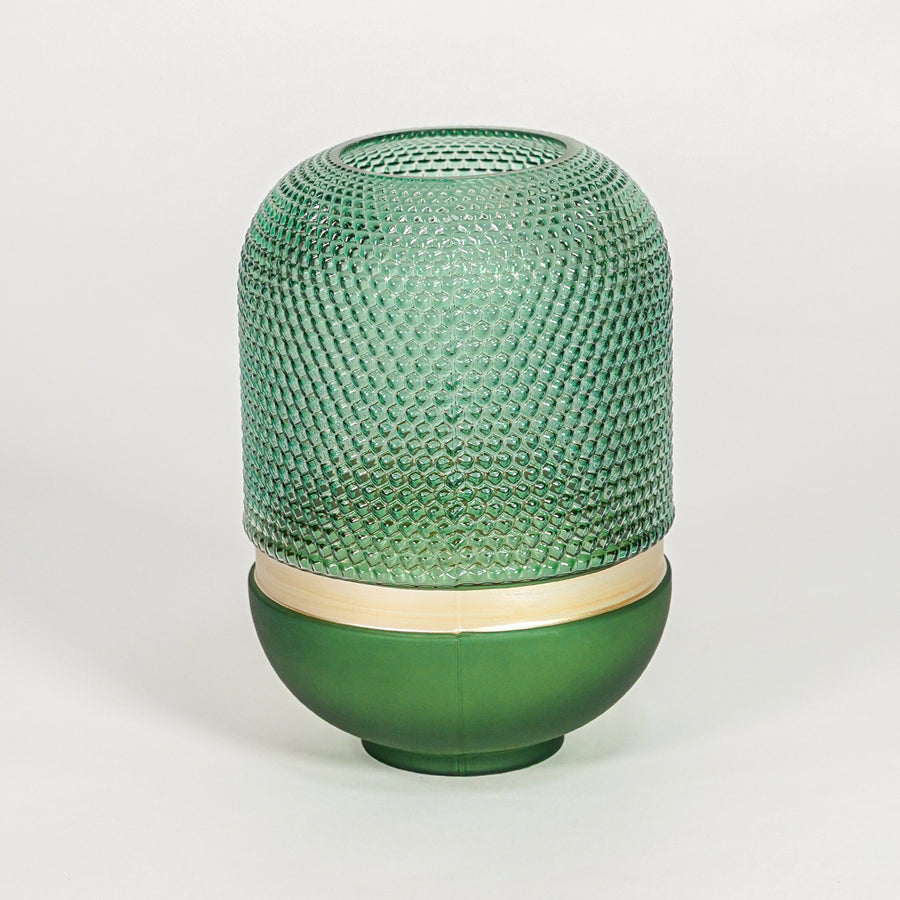 Green textured glass decorative vase with rounded silhouette for elegant tabletop styling and modern home decor.