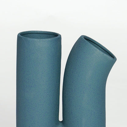 Teal matte ceramic modern vase with dual opening design for elegant living room and entryway decor styling.