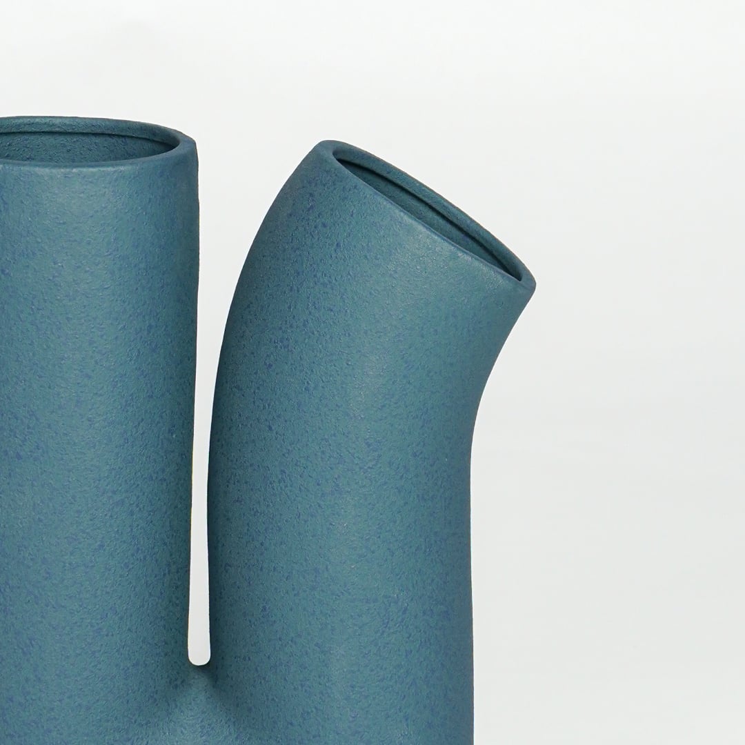 Textured teal ceramic artistic double spout vase ideal for console table shelf and office decor accent.