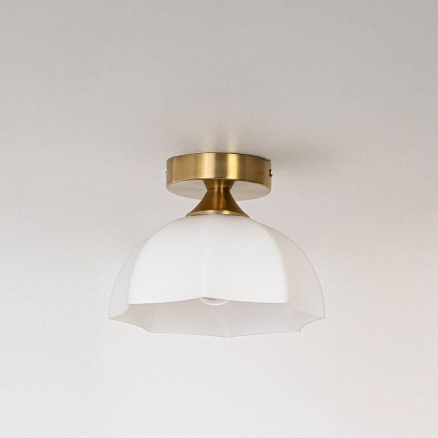 Modern white glass and gold metal ceiling light for stylish bedroom and premium interior decor styling spaces.