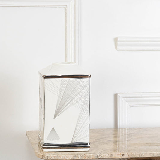 White ceramic jar with silver geometric line detailing perfect for modern home décor and clean minimalist styling.