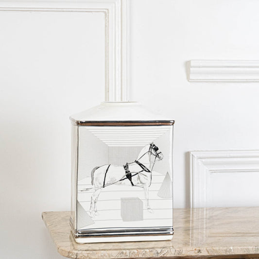 White ceramic jar with black galloping horse artwork in an angled view ideal for artistic décor and modern living room styling.