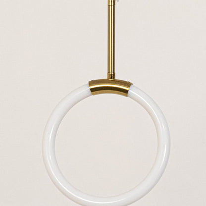 Closeup of modern gold pendant light with sleek circular frame and smooth finish showing fine detailing.