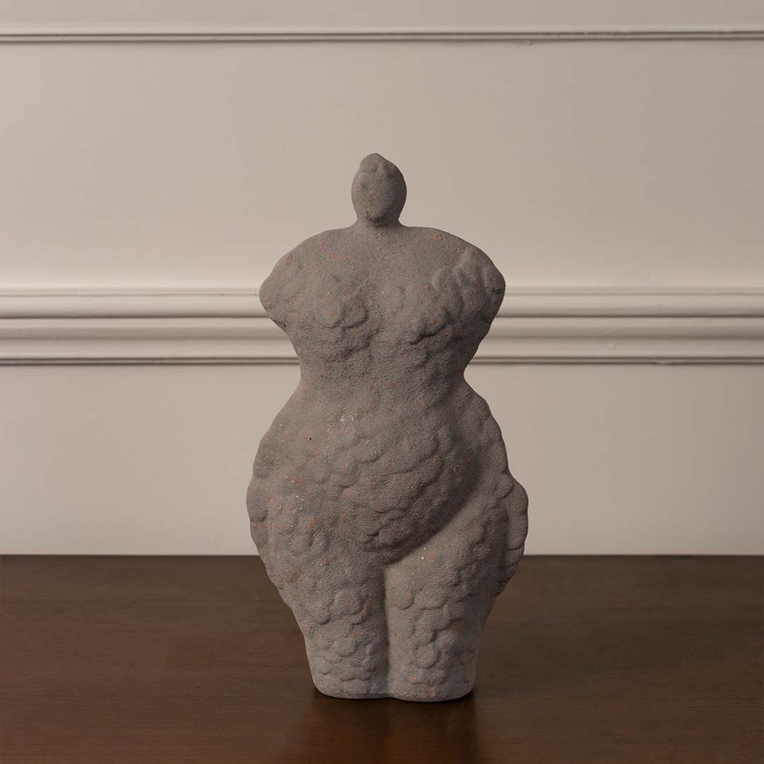 Grey ceramic torso sculpture vase with artistic textured finish designed for modern shelf and table decoration on white background.