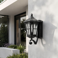 Classic black metal outdoor wall lantern for porch entrance driveway and exterior walls with elegant warm lighting.