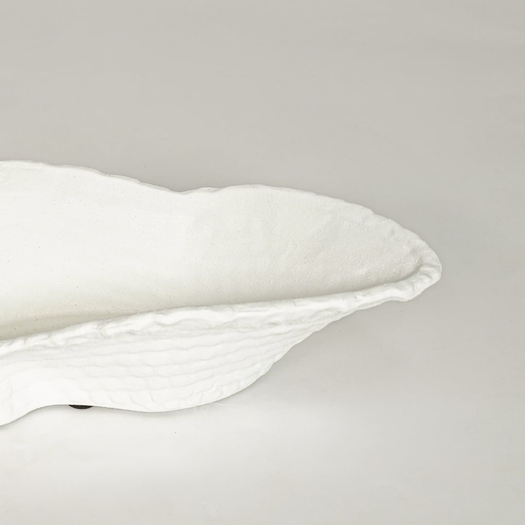 White ceramic textured decorative serving bowl ideal for fruit display on dining table centerpiece and contemporary home decor styling.