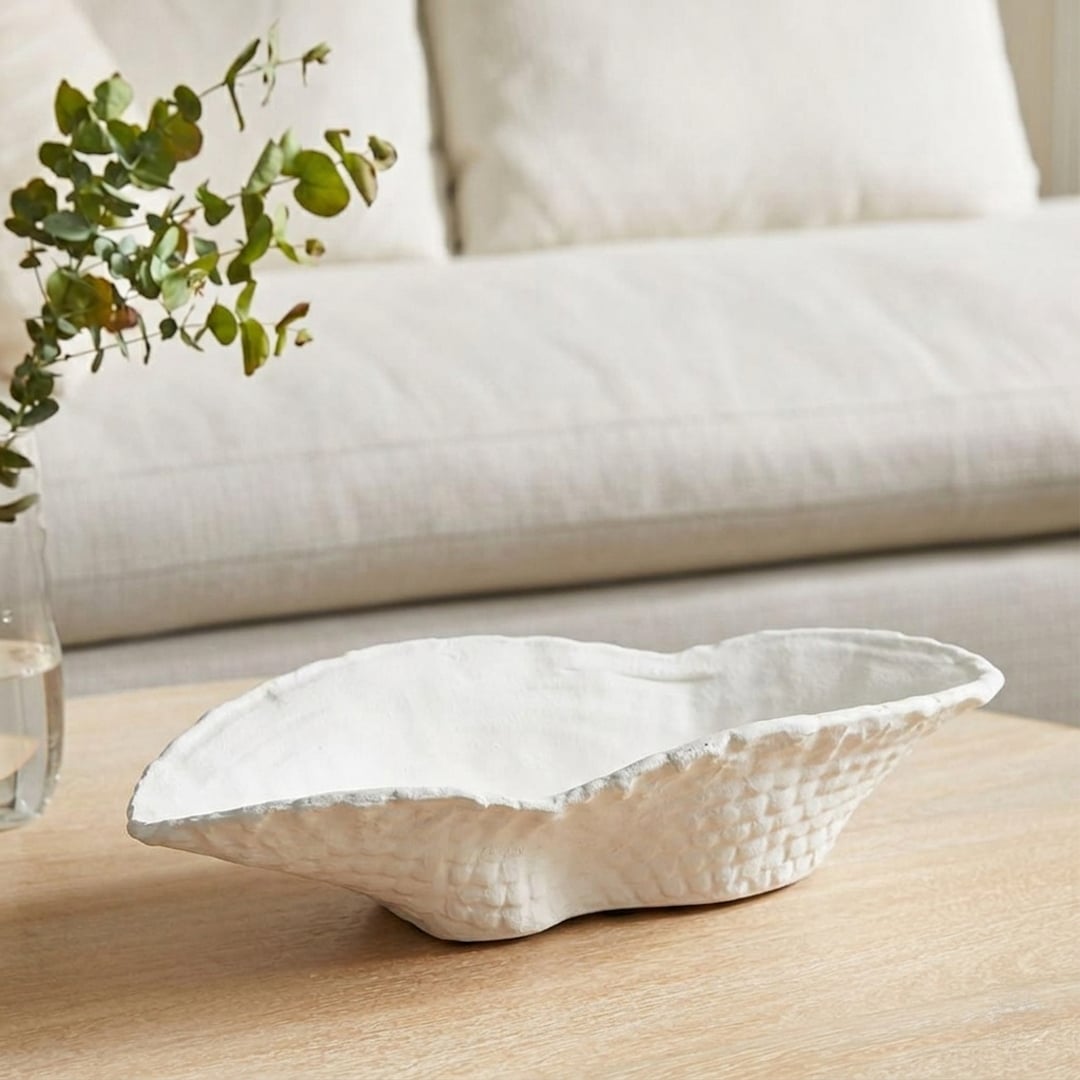 White ceramic decorative serving bowl with textured organic rim perfect for fruit display on dining table centerpiece and modern home decor.
