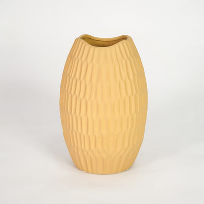 Yellow ribbed ceramic vase for elegant shelf placement and modern living room decor styling accent piece.