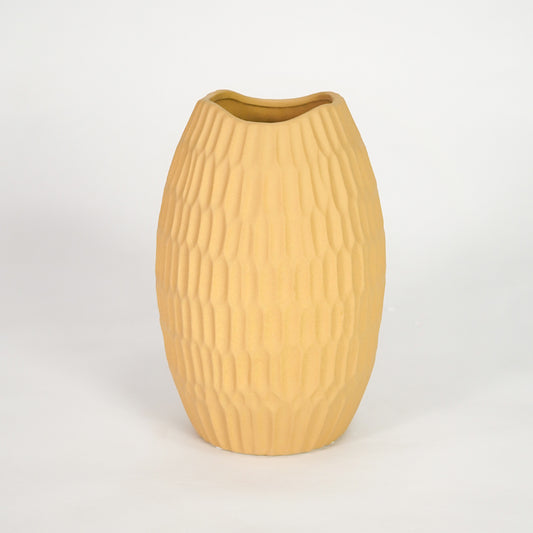 Yellow ribbed ceramic vase for elegant shelf placement and modern living room decor styling accent piece.
