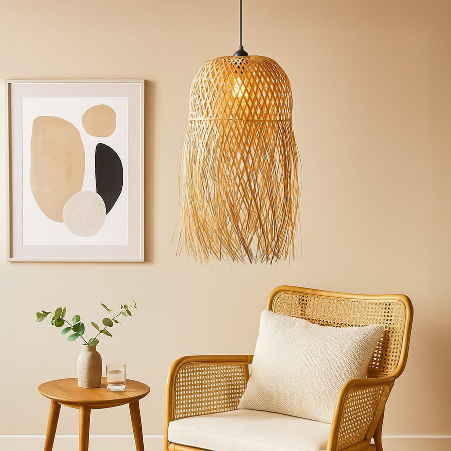 Handcrafted tiered bamboo ceiling light fixture in a bohemian living room with cream cushions textured rug pampas grass and macrame wall hanging.