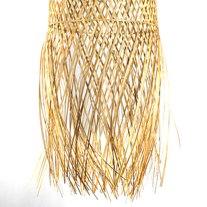 Natural woven rattan pendant light with flowing fringe texture displayed on white background for boho inspired ceiling lighting decor.