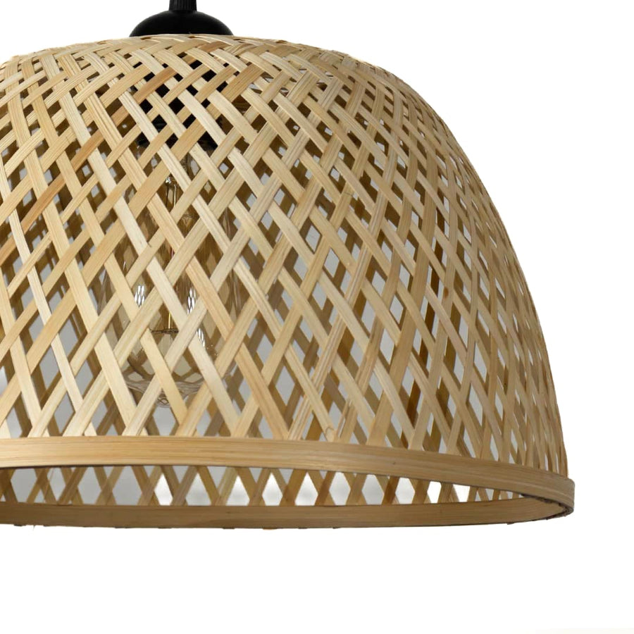 Closeup of woven beige rattan pendant light with black top showcasing intricate handcrafted texture.