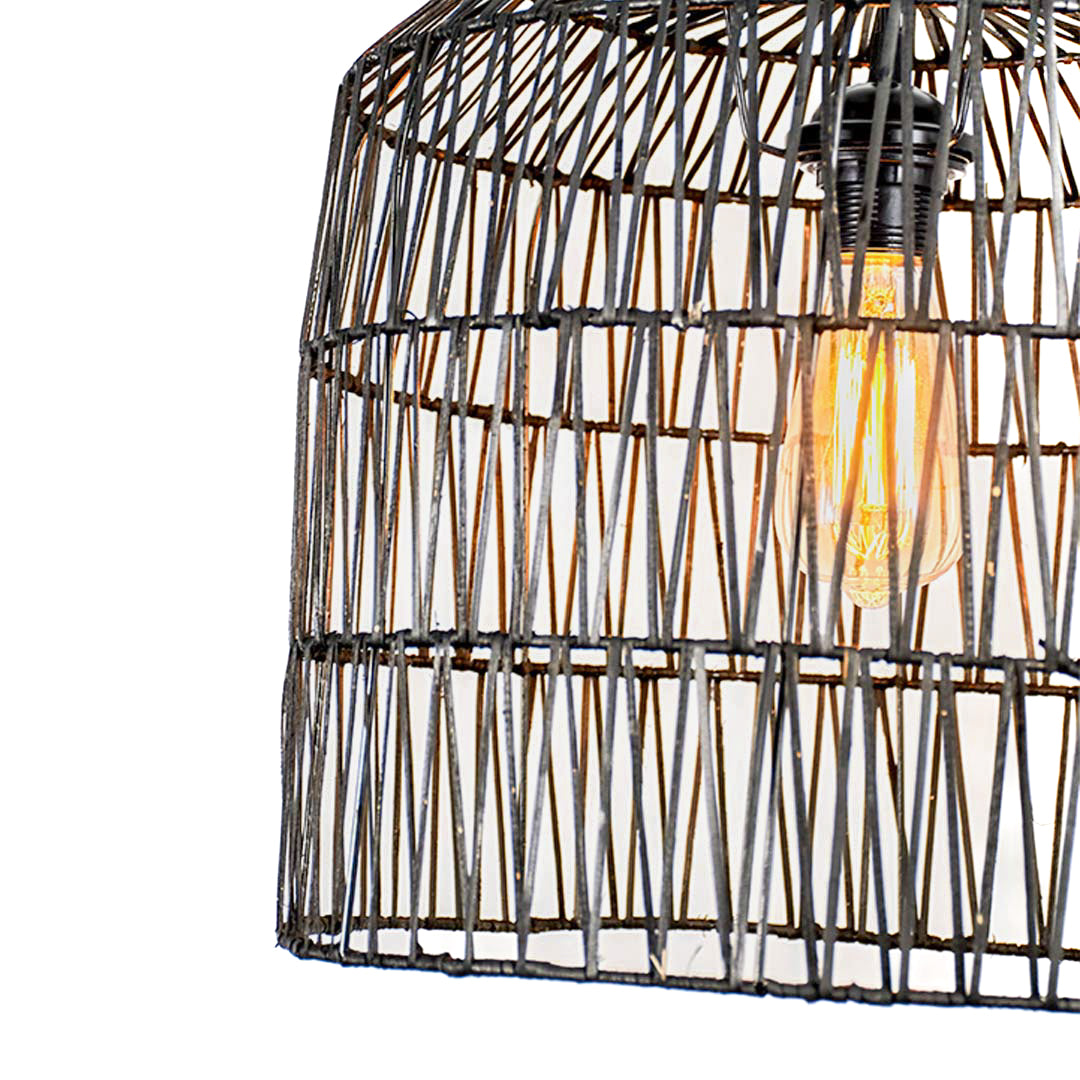 Black rattan pendant light shade with handcrafted woven wicker texture and open cage design for modern interior decor.