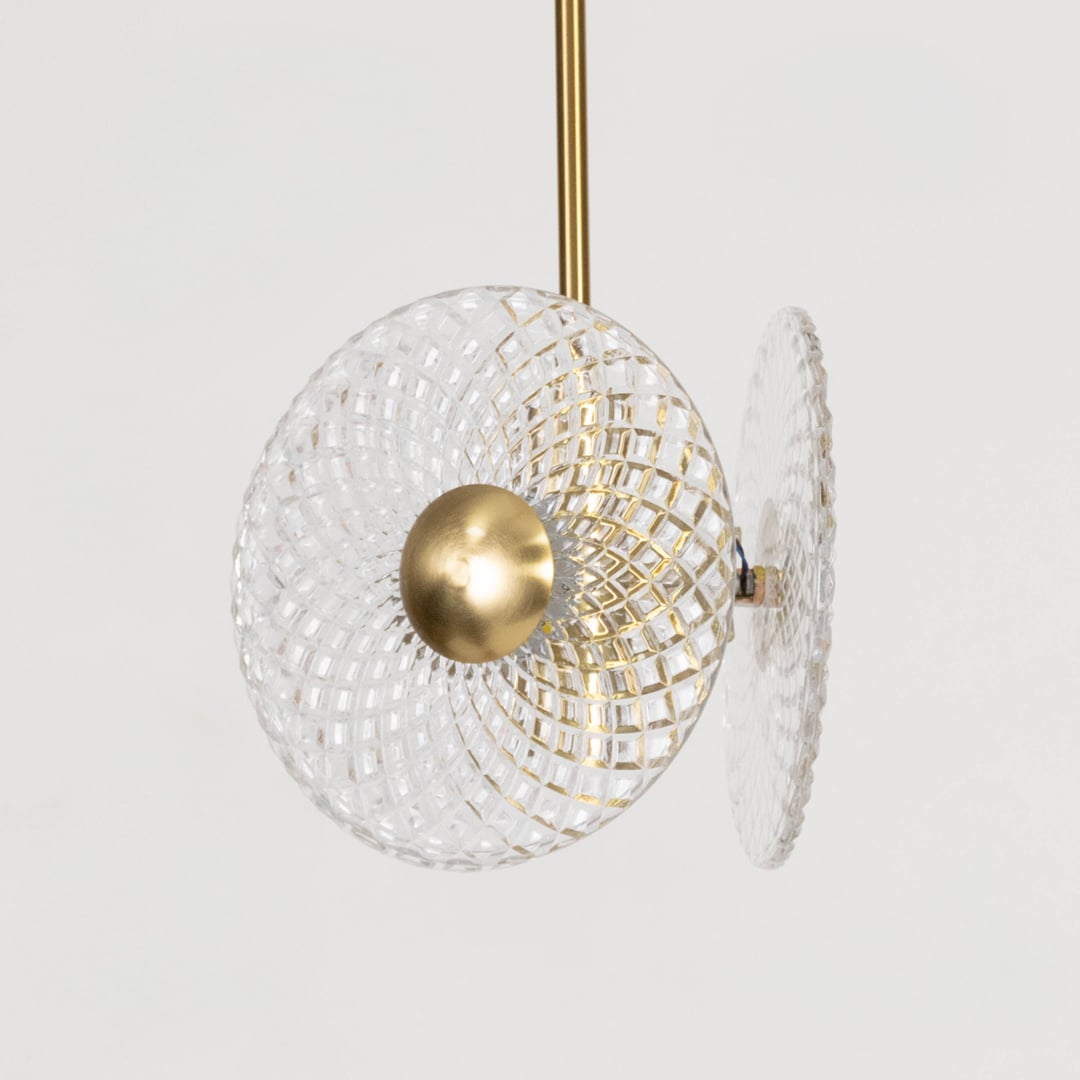 Contemporary pendant lamp with crystal textured glass and golden center perfect for elegant bedroom and living room.