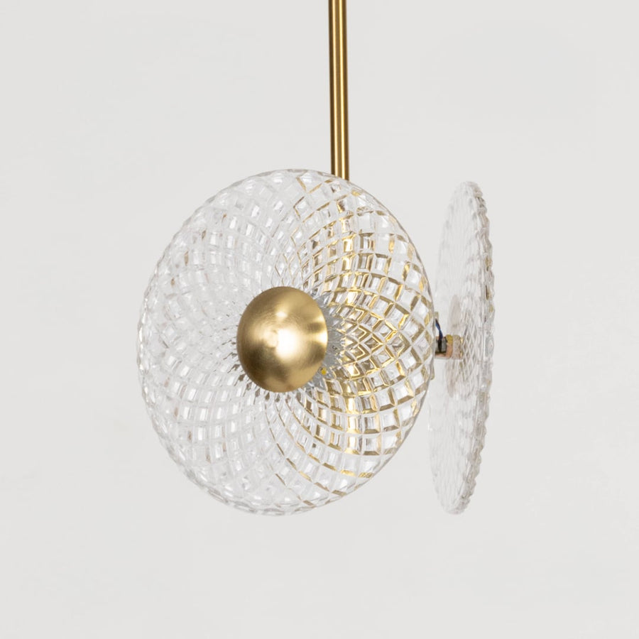 Contemporary pendant lamp with crystal textured glass and golden center perfect for elegant bedroom and living room.