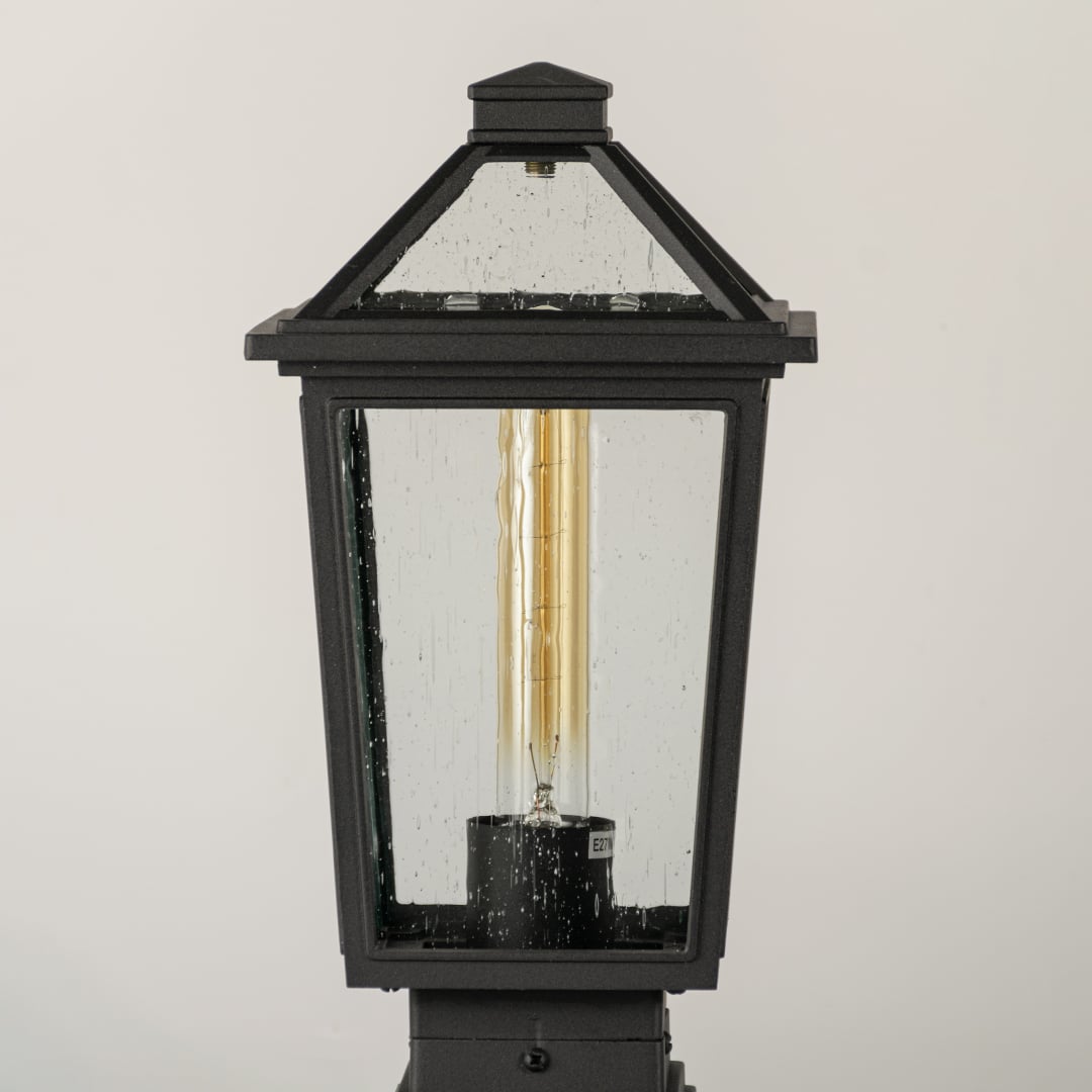 Black outdoor lantern Closeup showing the detailed metal finish and the clear pebbled glass panels.