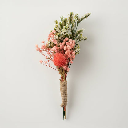 Dried floral stem bouquet with pink bloom white filler flowers and soft greenery on white background highlighting natural texture handcrafted charm and decor elegance.