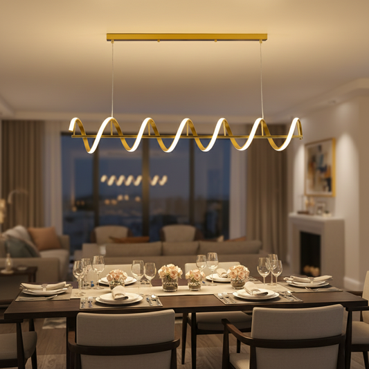 Gold metal chandelier with frosted glass globe shades illuminating dining table setting in modern luxury interiors.