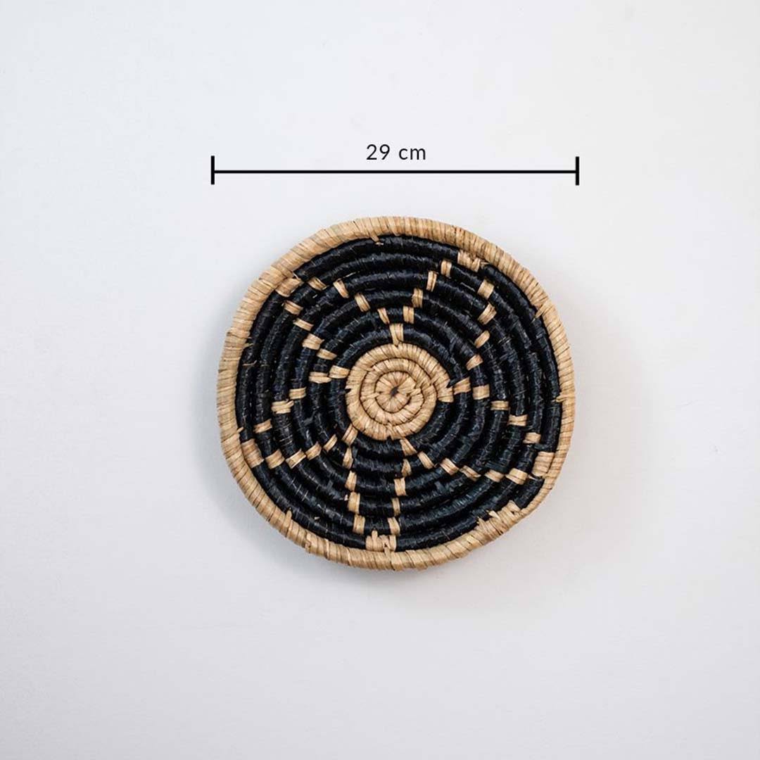 Handwoven seagrass round wall basket decor in natural beige and black with spiral woven design and size guide.
